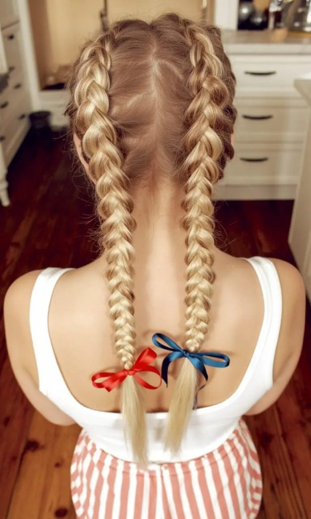 Double Dutch Braids with Subtle Patriotic Ribbon Ties
