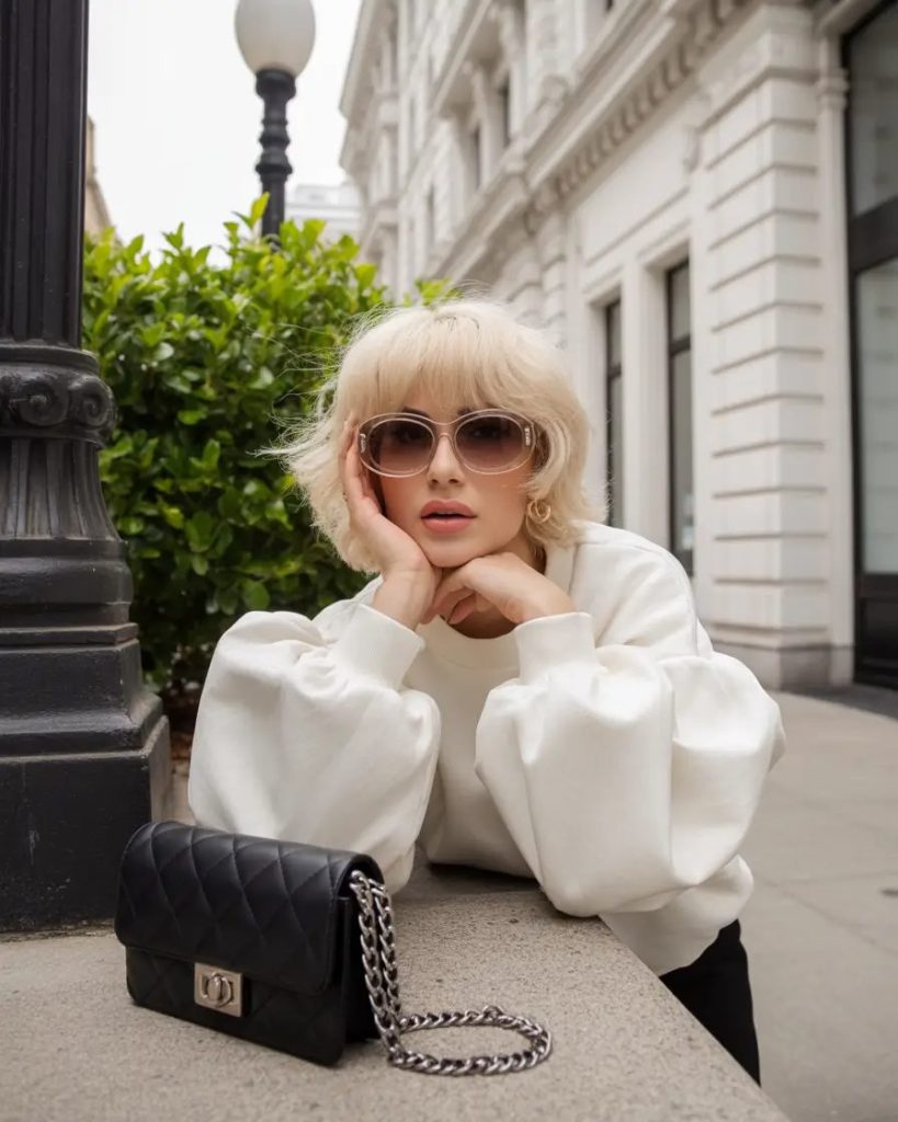 Feathered Platinum Bob with Parisian Bangs
