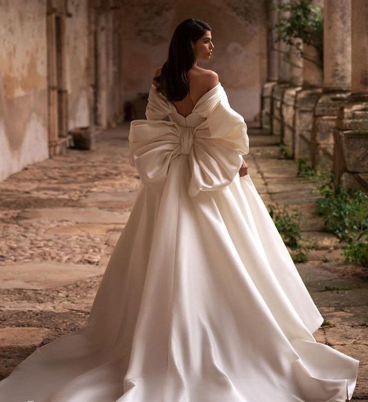Elegant Off-the-Shoulder Satin Gown with Dramatic Bow