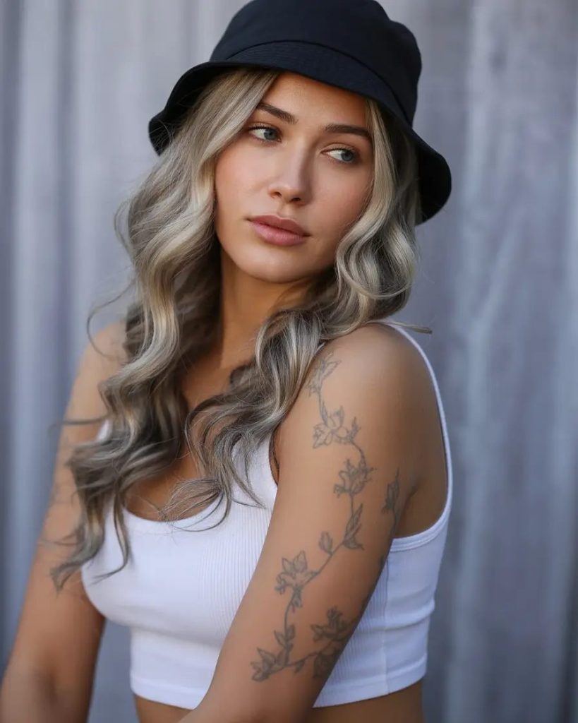 Glossy Loose Curls & Bucket Hat Chic
