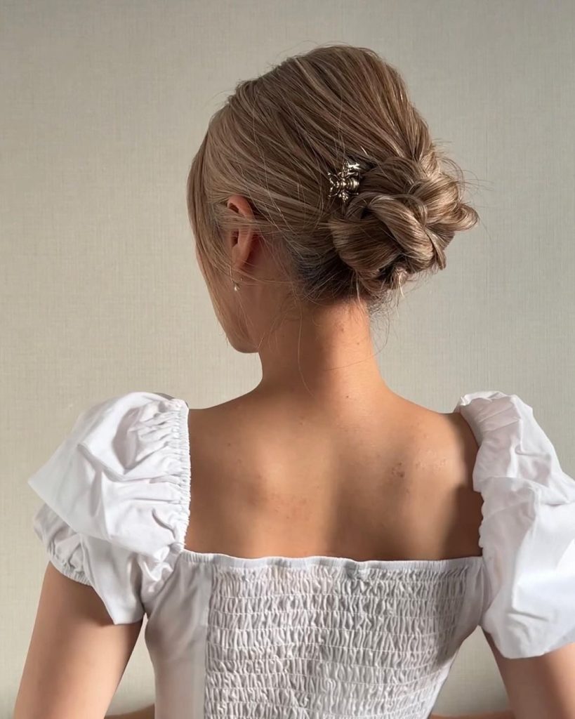 Elegant Low Bun with Floral Pin